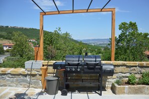 Try cooking on a dual fuel BBQ (gas and charcoal) with views to Trieste bay