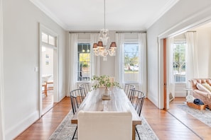Dining area sits between living room and kitchen.