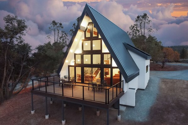 A shop stopping modern Scandinavian style A-Frame with large glass windows.