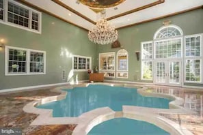 View of indoor pool looking south towards main house.