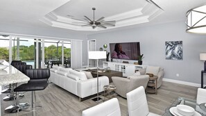 Living room with view over the terrace and pool 