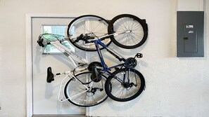 2 bicycles are in the garage for trips