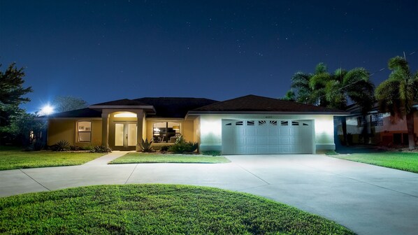 Starry sky over Villa Su Casa illuminated in the evening