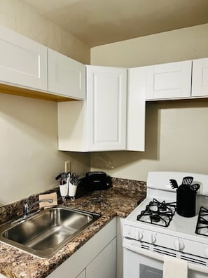 Kitchen is fully equipped with appliances