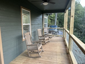 Four rocking chairs for guests. Cozy thraws for keeping worm on chilly nights.