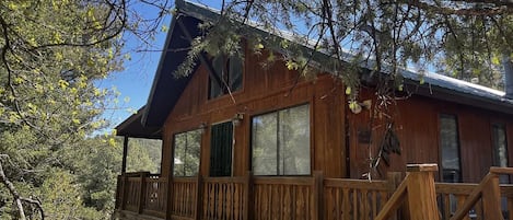 Front door on left side of deck