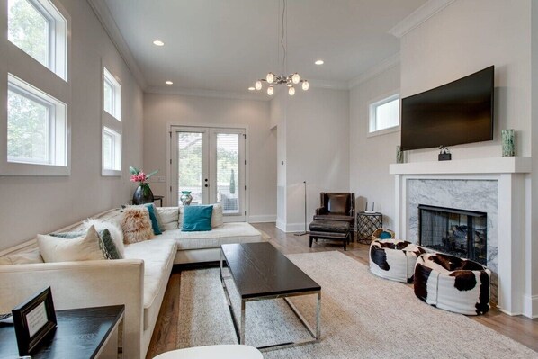 Curl up for movie night or host a memorable gathering in this cozy living space, designed for comfort and entertainment.