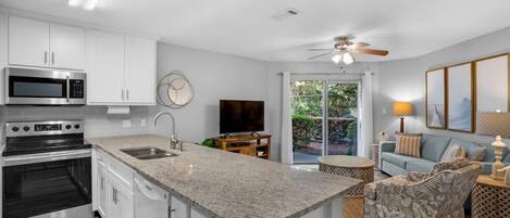 Kitchen/Living Area | Flat Screen TV | Stainless Steel Appliances | Queen Sleeper Sofa