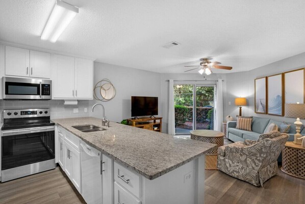 Kitchen/Living Area | Flat Screen TV | Stainless Steel Appliances | Queen Sleeper Sofa