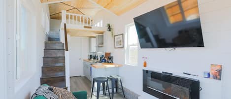 The living area is the perfect space to unwind after a day of adventure in Teton Valley.Experience the allure of small-scale living without compromising on comfort or style at this lovely Teton Valley tiny home!