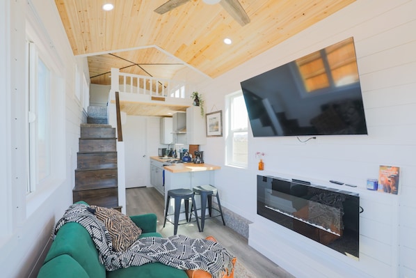 The living area is the perfect space to unwind after a day of adventure in Teton Valley.Experience the allure of small-scale living without compromising on comfort or style at this lovely Teton Valley tiny home!