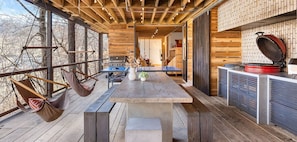 Enjoy outdoor cooking, dining, games and evening lights to swing your worries away