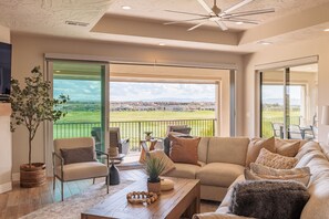 Living Area with Patio Doors Open - Large sliding doors enable the combining of indoor and outdoor spaces for a fun filled evening.