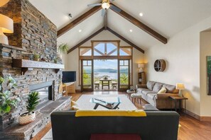 This custom built home has amazing views set on acreage overlooking Lake Pend Oreille