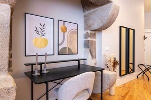 A chic color palette of soft neutrals and subtle accents creates an inviting ambiance, while tasteful artwork adorns the walls.