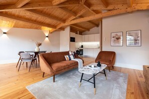 This premium apartment offers a seamless transition between the living room, dining area and kitchennette, creating a harmonious and spacious environment.