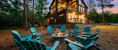 Enjoy the pine trees and bright stars on spacious acreage around the firepit.  