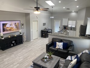 Spacious living space with leather couches. 