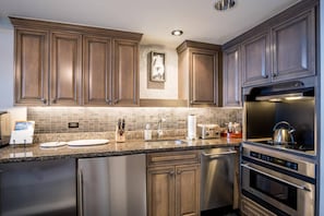 Full Kitchen with upgraded appliances, including a wine cooler.