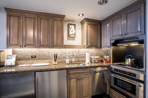 Full Kitchen with upgraded appliances, including a wine cooler.