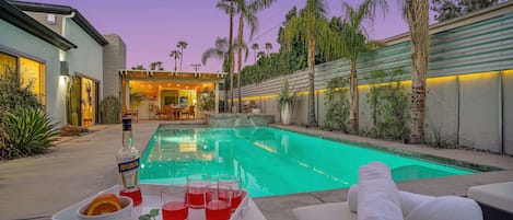 Backyard and pool with our frequent purple sunsets.