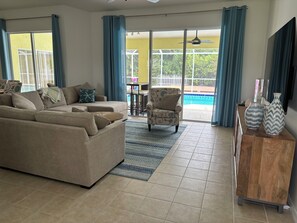 Living Room - 9’ sliding doors open to provide indoor / outdoor living space