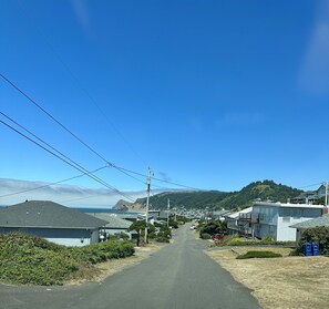 In front of the house looking north to road end beach access within 5 mins walk