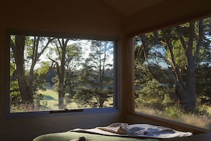 Bed with a view over rolling hills