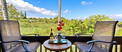 Lush garden views with partial ocean in the distance