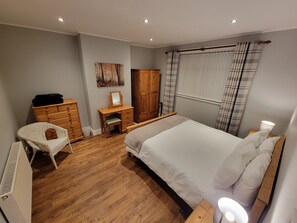 Main bedroom with view of rear garden