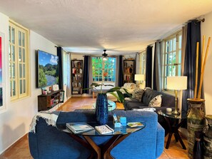 Relax in the large living room with lots of windows