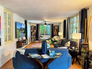 Relax in the large living room with lots of windows