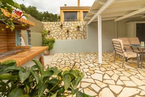 Outdoor dining with BBQ and covered pergola