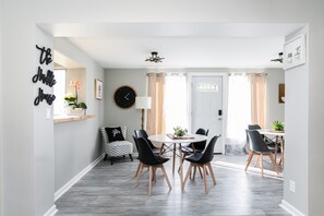 Open dining area with lots of seating and easy access to the patio and backyard