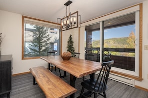 A long spacious dining table is suited for your dine-in evenings, with large windows to keep you connected with the outdoors