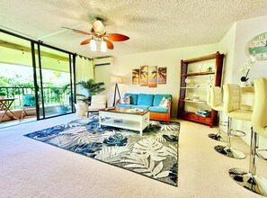 Main living room with pull out couch and 55" tv