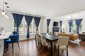 The table's generous dimensions ensure there's ample space for family feasts or intimate dinners with friends.