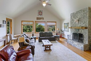 Great Room with Vaulted Ceilings and Wood Burning Fireplace