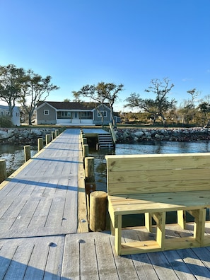 The Ferry House dock with benches to enjoy views and steps for water access.