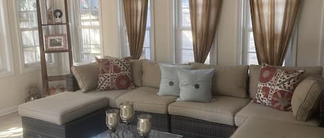 Sunroom off of the kitchen area with access to the backyard.