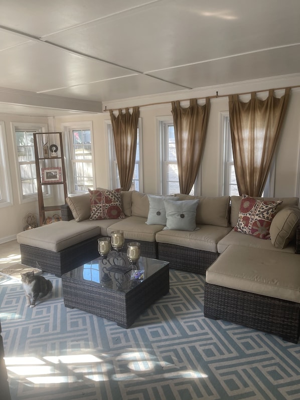 Sunroom off of the kitchen area with access to the backyard.