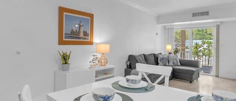 Dining & Living room with access to the balcony that faces the pool
