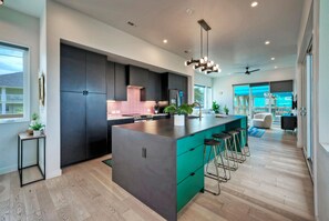 Kitchen features barstool seating.