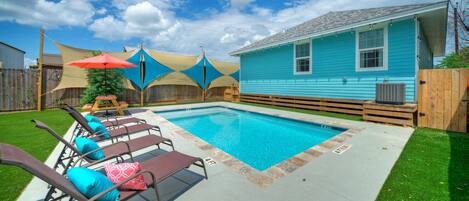 Midday bliss by the pool with comfy lounge chairs