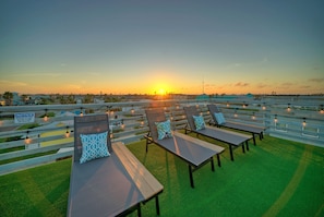 Watch stunning sunsets from your private rooftop deck.