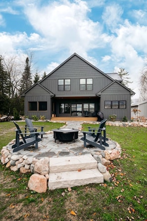 A view from the backyard, facing towards the house and away from the lake