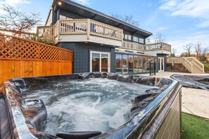 This is a 7-8 person hot tub. Yes, it is open, heated, and running year-round.