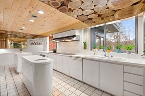 Stocked full size kitchen w/ large 10 burner stove top, 2 ovens, 2 fridges,  etc