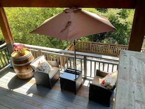 Sitting area for two to enjoy the deck during the warmer weather.
