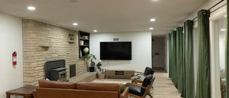 Spacious living room with 4K 75" TV